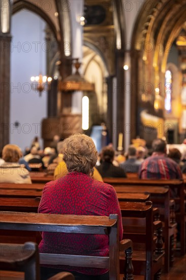 Faithful old lady in the church