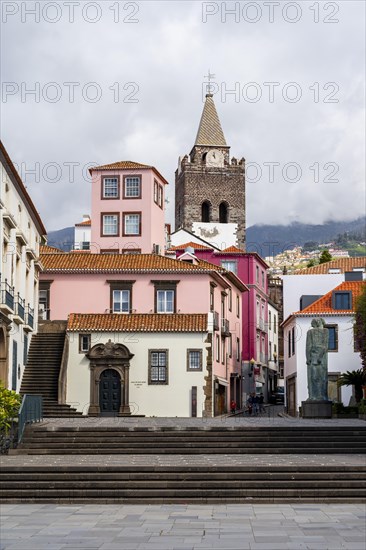 Small square in the old town with colourful houses and chapel Capela de Santo Antonio de Mouraria