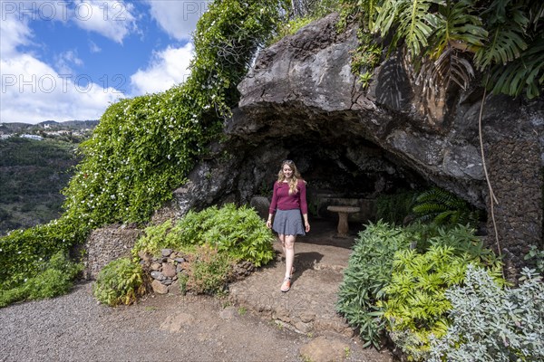 Woman at a cave