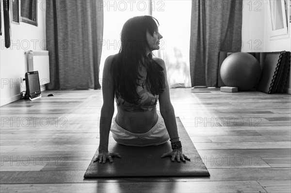 Front view of a woman practicing yoga