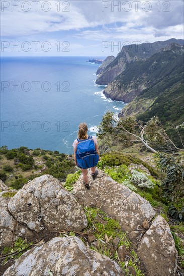 Hiker on the ridge of Pico do Alto