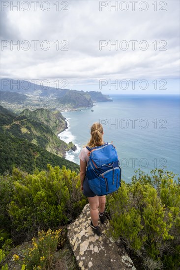 Hiker on the ridge of Pico do Alto