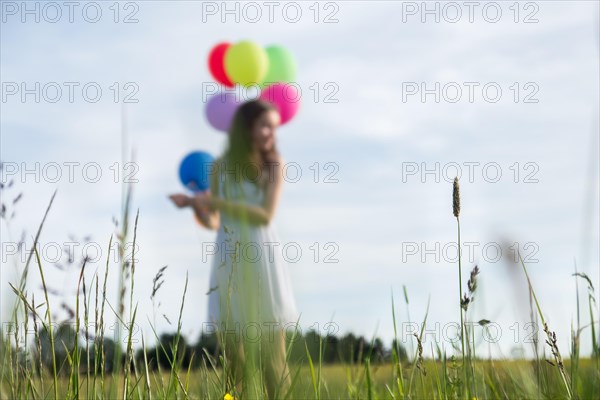 Little girl with balloons