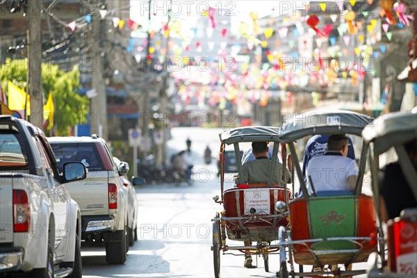 Cycle rickshaws on decorated street