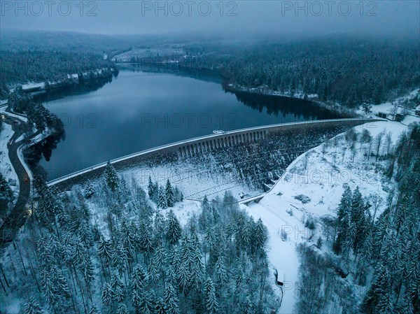 Schwarzenbachtalsperre in darkness in winter with snow