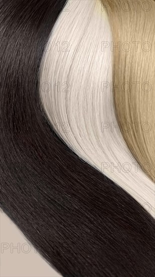 Strands of natural hair of different colors for extensions