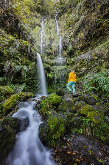 Hiker in front of waterfall