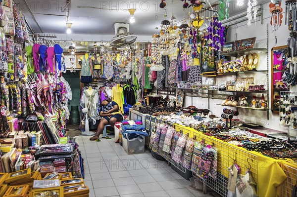 Souvenir shop with sleeping saleswoman on Ko Phi Phi island