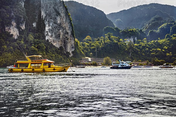 Rock walls and dive boats on Ko Phi Phi island