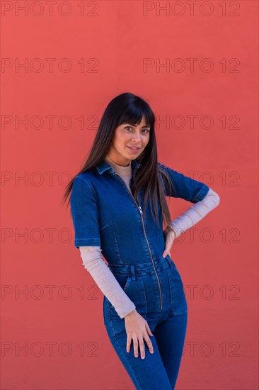 Brunette girl smiling in a denim outfit