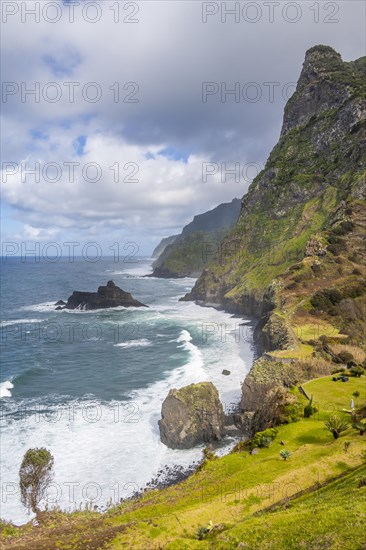 View of steep cliffs and coast with sea