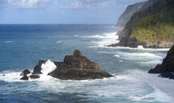 View of steep cliffs and coast with sea