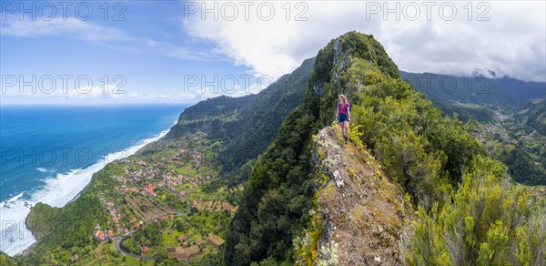 Hiker on the ridge of Pico do Alto