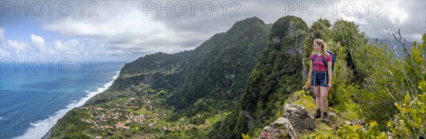 Hiker on the ridge of Pico do Alto