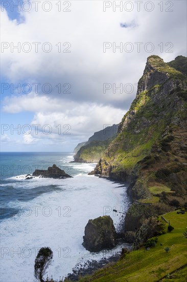 View of steep cliffs and coast with sea