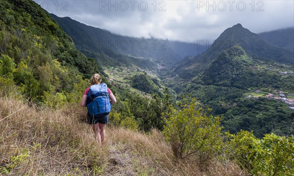 Hiker overlooking a mountain valley