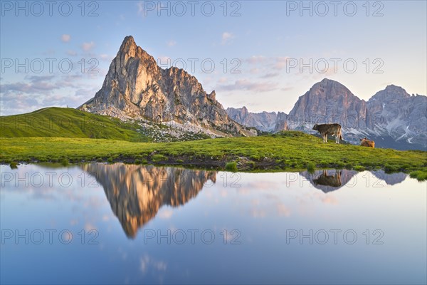 Mountain lake with mountain panorama at sunrise