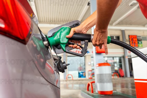 Refueling gasoline or diesel at the gas station in the fuel crisis with the high prices