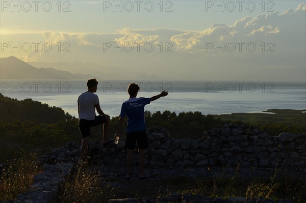 Two young men looking at Lake Scutari
