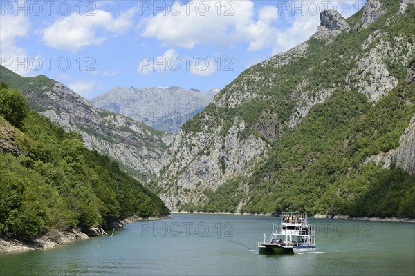 Car ferry on the dammed river Drin