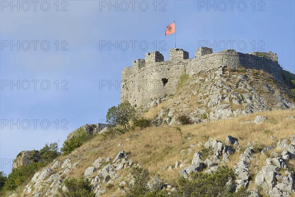 Rozafa Castle with Albanian flag