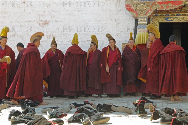 Yellow-capped monks at the prayer hall
