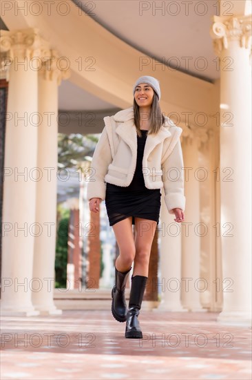 Woman with wool hat visiting a city park