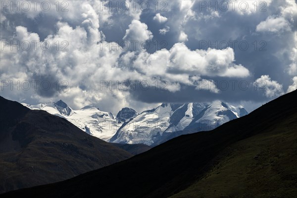 Bernina Group with dramatic cloudy sky