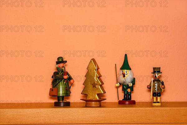 Christmas decoration consisting of three incense smokers and a candle in the shape of a fir tree