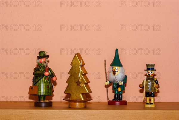 Christmas decoration consisting of three incense smokers and a candle in the shape of a fir tree
