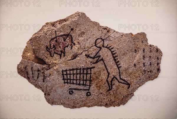 Banksys version of a primitive cave painting on the prowl with a shopping trolley