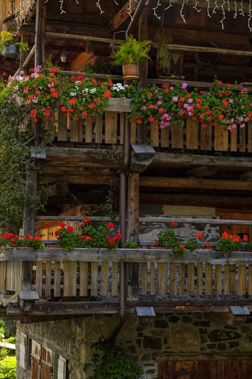 Old farmhouses with floral decorations in the village of Sottoguda near Rocca Pietore Rocia