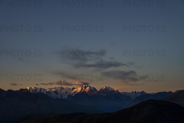 Summit of the Bernina Group with dramatic cloudy sky