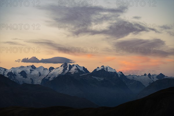 Summit of the Bernina Group with dramatic cloudy sky