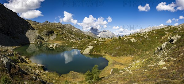 Small mountain lake with Engadine peaks in the background