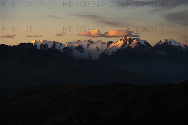 Summit of the Bernina Group with dramatic cloudy sky