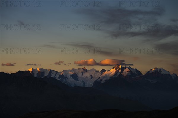 Summit of the Bernina Group with dramatic cloudy sky