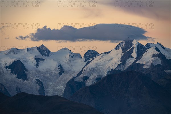 Summit of the Bernina Group with dramatic cloudy sky