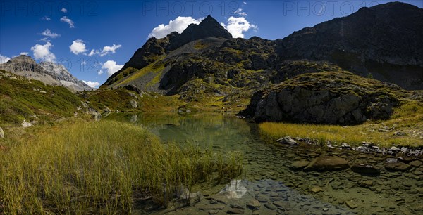 Small mountain lake with Engadine peaks in the background