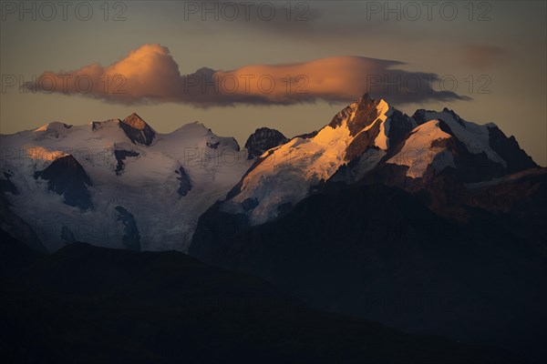 Summit of the Bernina Group with dramatic cloudy sky