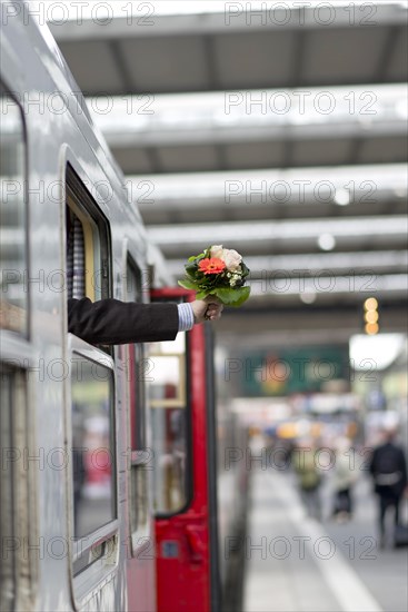 Reception with a bouquet of flowers at the station