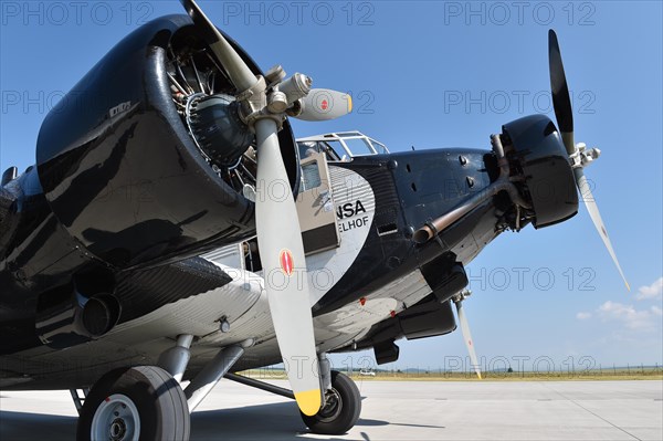 Propeller plane Ju 52 on the tarmac