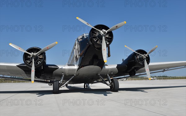 Propeller plane Ju 52 on the tarmac