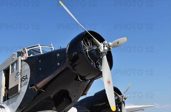 Propeller plane Ju 52 on the tarmac