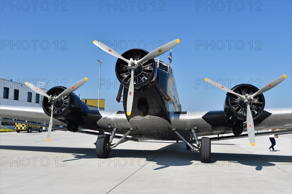 Propeller plane Ju 52 on the tarmac