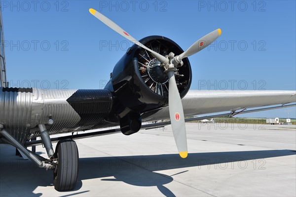 Propeller plane Ju 52 on the tarmac