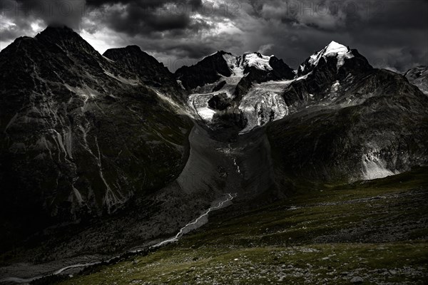 Summit of the Bernina Group with dramatic clouds