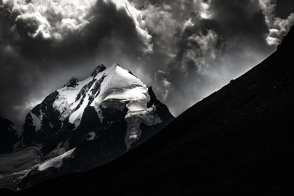 Piz Rosegg with Bernina Group and cloudy sky