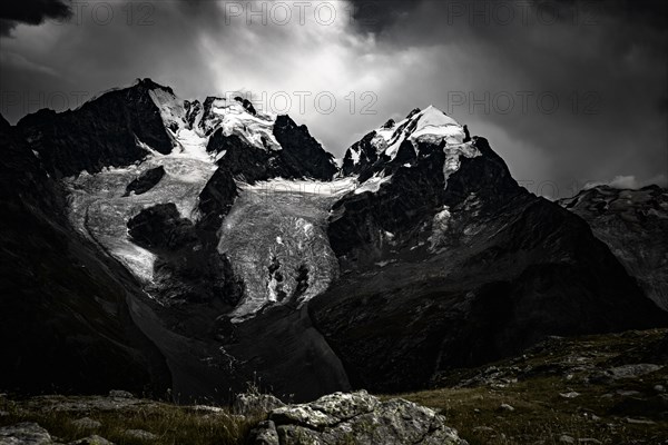 Summit of the Bernina Group with dramatic clouds