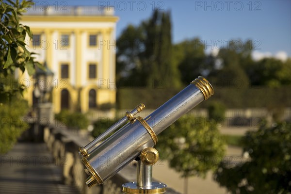 Old telescope at the orangery with baroque park Karlsaue
